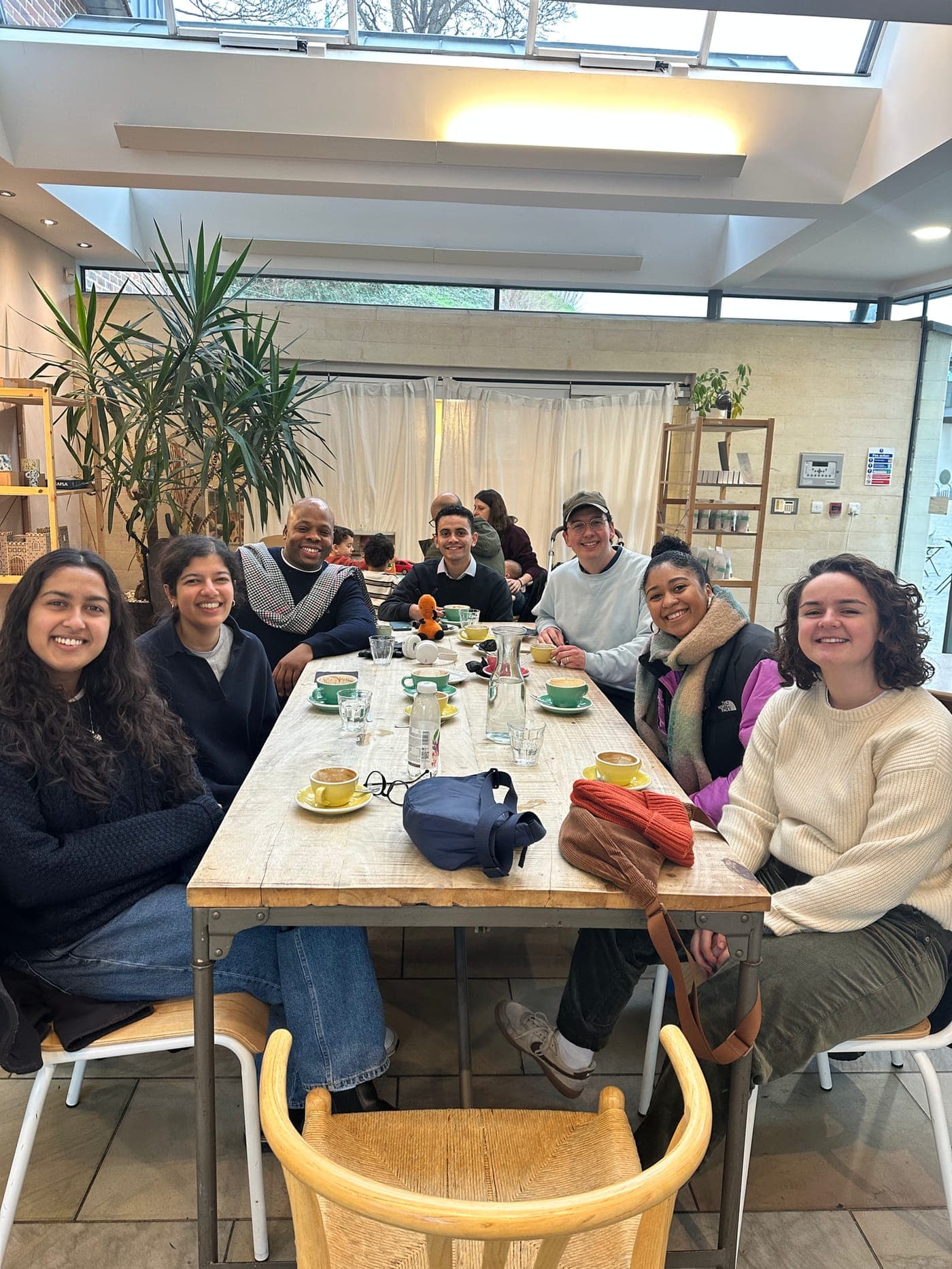 A group gathered around a table for a community meal