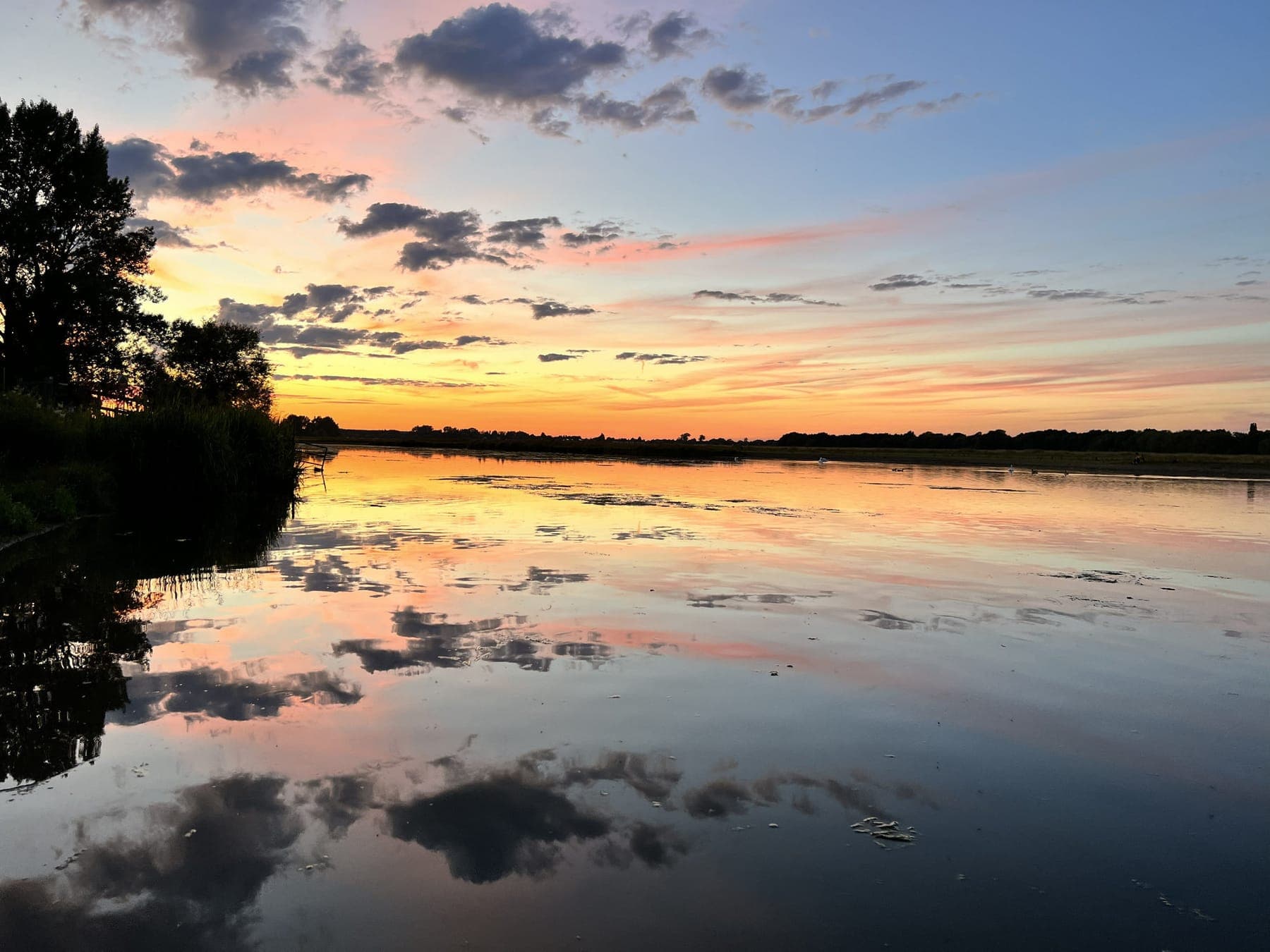 A sunset reflected in still water