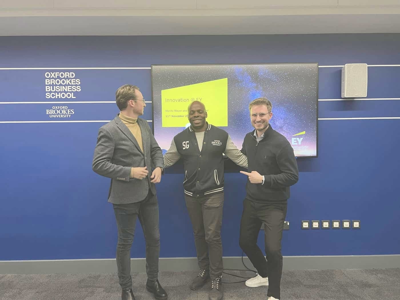 Steven Gordon with two hosts after a university talk